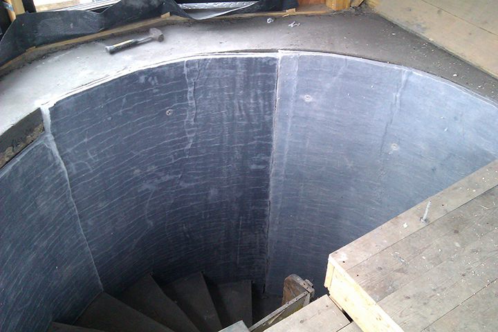 https://www.aerogel.com/wp-content/uploads/2021/06/Spaceloft-Grey-30mm-internal-concrete-stairwell-mechanically-fixed-flexible.jpg